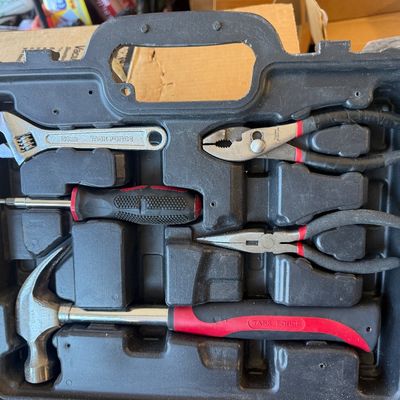Sale Photo Thumbnail #241: Task Force hand tool set in a black molded plastic case, including a claw hammer, adjustable wrench, multi-bit screwdriver, slip-joint pliers, and needle-nose pliers.