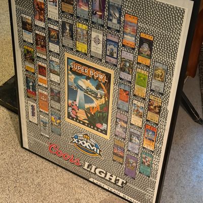 Sale Photo Thumbnail #118: Framed Coors Light Super Bowl XXXVII promotional poster, featuring a collection of replica or historic Super Bowl ticket stubs surrounding a central San Diego event graphic.