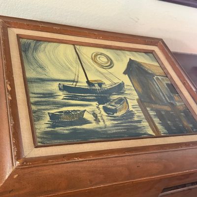 Sale Photo Thumbnail #37: Mid-century nautical oil painting featuring boats near a dock, housed in a double-matted wooden frame with minor edge wear.