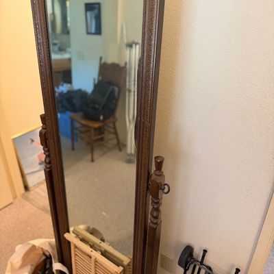 Sale Photo Thumbnail #176: Traditional wooden cheval floor mirror featuring a turned post frame and dark stain finish.