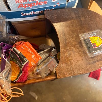 Sale Photo Thumbnail #45: Vintage wood sewing cabinet filled with assorted household items and clear plastic storage containers.