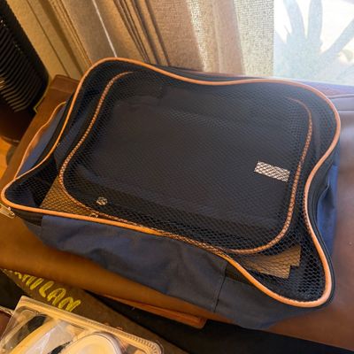 Sale Photo Thumbnail #310: Navy blue fabric packing cube set with tan trim and breathable mesh tops.