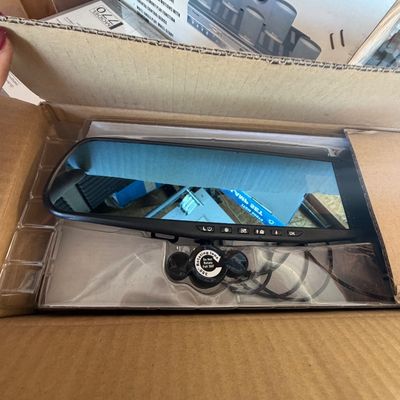 Sale Photo Thumbnail #225: Unused smart rearview mirror dash cam with integrated controls, stored in its original packaging.