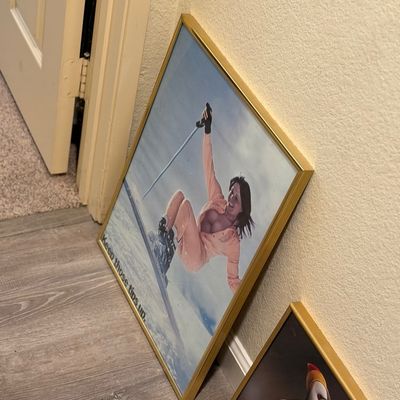 Sale Photo Thumbnail #185: Vintage framed skiing poster featuring humor artwork with the text 'Keep those tips up', set in a thin gold metal frame.