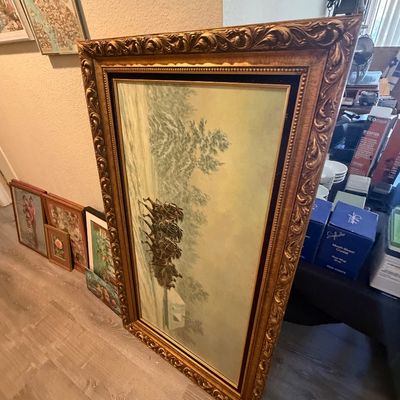 Sale Photo Thumbnail #121: Large vintage framed painting featuring a winter horse-drawn sleigh scene, set inside an ornate gilded wood frame.
