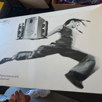 Sale Photo Thumbnail #238: Vintage early-2000s multimedia computer speaker system boxed set featuring a silver subwoofer and two satellite speakers.