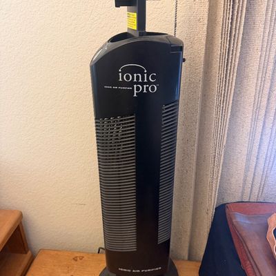 Sale Photo Thumbnail #307: Black Ionic Pro tower air purifier with removable collector blades shown partially extended.