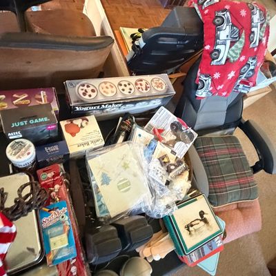 Sale Photo Thumbnail #125: Collection of assorted household items and office furniture, including a boxed yogurt maker, garlic baker, decorative tins, and an ergonomic desk chair.
