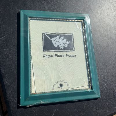 Sale Photo Thumbnail #289: Teal green wood picture frame sized for an 8x10 photo, still in original plastic wrap with inner gold rope trim detailing.