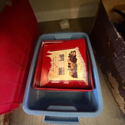 Sale Photo Thumbnail #80: Trader Joe's Belgian cookie tin stored inside a blue plastic bin.