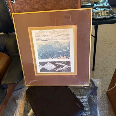 Sale Photo Thumbnail #167: Framed marine life art print displaying three panel illustrations of fishing, underwater life, and fish, presented in a thin gold metal frame with a brown mat.