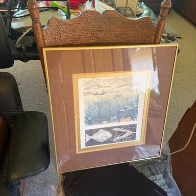 Sale Photo Thumbnail #12: Framed aquatic and marine life art print featuring three panels in a thin metallic frame, displayed resting on an carved wooden chair.