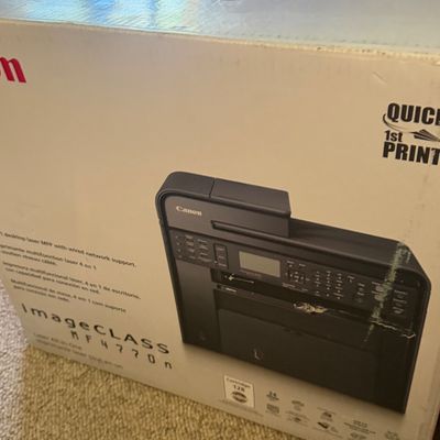 Sale Photo Thumbnail #32: Canon imageCLASS MF4770n laser all-in-one printer inside its original retail box.