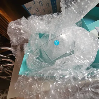 Sale Photo Thumbnail #25: Tiffany & Co. clear crystal vase featuring a round 'Made in Italy' sticker, packed in bubble wrap inside its original blue box.