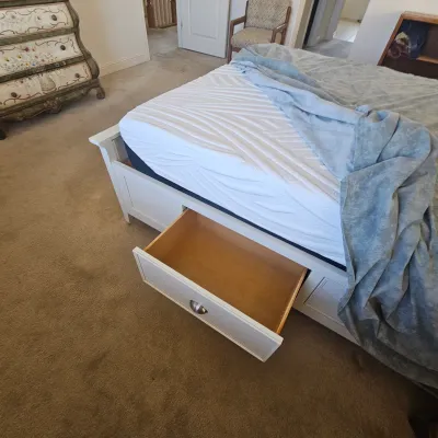 Sale Photo Thumbnail #69: Contemporary white wooden platform bed frame featuring built-in under-bed storage drawers with silver cup pulls, shown with a mattress.