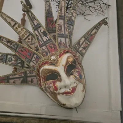 Sale Photo Thumbnail #17: Ornate Venetian jester mask featuring tarot card imagery along the points, gold trim, and hand-painted details.