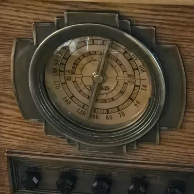 Sale Photo Thumbnail #90: Vintage Crosley Art Deco-style AM/FM radio dial set within a wooden cabinet.