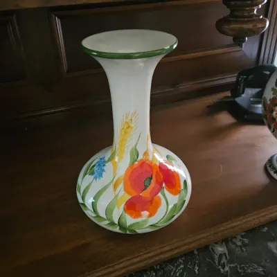 Sale Photo Thumbnail #32: Hand-painted white ceramic vase decorated with vibrant red poppies, blue cornflowers, and wheat stalks with a green-rimmed mouth.