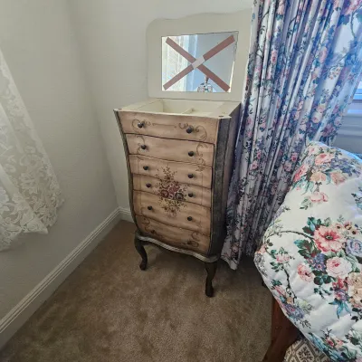 Sale Photo Thumbnail #71: Hand-painted vintage standing jewelry armoire featuring a top flip-lid with mirror, floral motif drawer fronts, and cabriole legs.