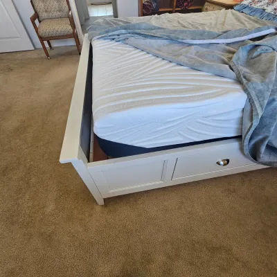 Sale Photo Thumbnail #68: White wooden storage bed frame with a memory foam mattress and under-bed drawers.