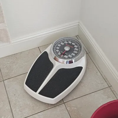 Sale Photo Thumbnail #62: Vintage Health o Meter analog bathroom scale with a white body, black textured mats, and a large chrome-rimmed dial.