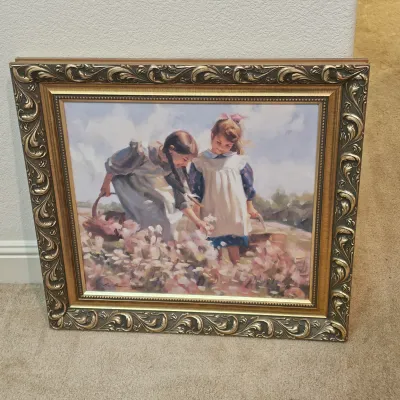 Sale Photo Thumbnail #19: Framed impressionistic print depicting two young girls gathering flowers in a field, housed in an ornate carved gold-tone frame.