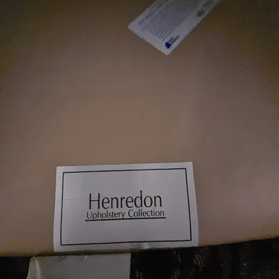 Sale Photo Thumbnail #101: Henredon Upholstery Collection maker's tag on a piece of furniture.