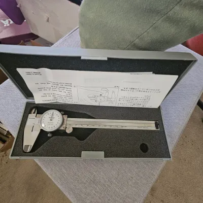 Sale Photo Thumbnail #45: Mitutoyo jeweled dial caliper in original fitted case with instruction manual.