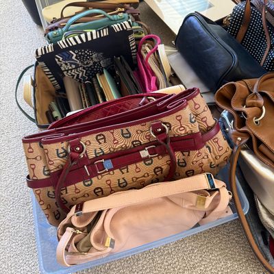 Sale Photo Thumbnail #20: Large collection of women's handbags and totes, including an Etienne Aigner monogram shoulder bag, a soft pink leather purse, and various leather and fabric bags.