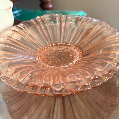 Sale Photo Thumbnail #54: Pair of vintage pink Depression glass plates with ribbed, scalloped edges and intricate center medallion details.