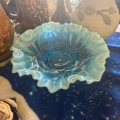 Sale Photo Thumbnail #113: Vintage aqua opalescent glass bowl featuring ruffled edges and a molded strawberry pattern, displayed alongside ceramic steins and a stoneware pitcher.