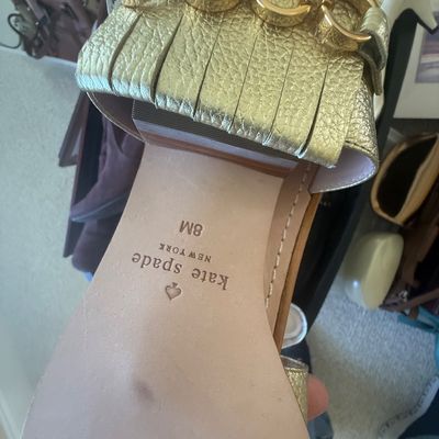 Sale Photo Thumbnail #192: Kate Spade New York metallic gold leather fringe sandal in size 8M, featuring gold-tone chain hardware.