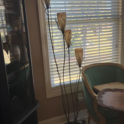 Sale Photo Thumbnail #70: Contemporary multi-light floor lamp with organic metal stems and crackled amber glass shades.