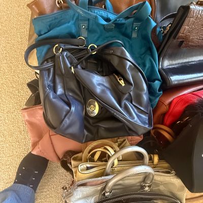 Sale Photo Thumbnail #164: Large assortment of women's handbags and totes in various styles, colors, and materials, including leather, nylon, and designer canvas pieces.
