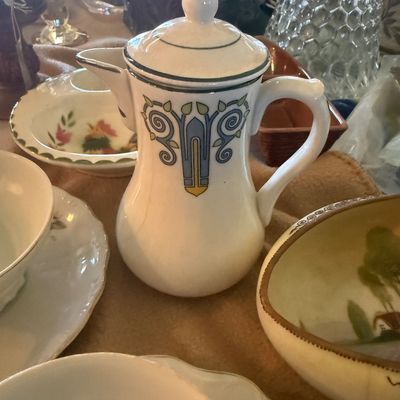 Sale Photo Thumbnail #110: Vintage ceramic coffee pot or pitcher featuring an Art Nouveau blue, yellow, and green geometric scroll design with a matching lid.