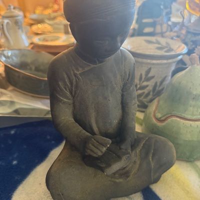 Sale Photo Thumbnail #114: Cast metal or ceramic figurine depicting a seated Asian scholar or scribe writing on a tablet.