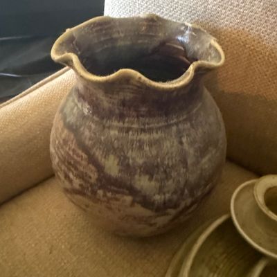 Sale Photo Thumbnail #111: Studio pottery vase featuring a ruffled rim and marbled brown and beige glaze finish.