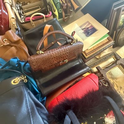 Sale Photo Thumbnail #9: Large collection of vintage and contemporary women's handbags, totes, and purses, displayed alongside framed art and decorative items.