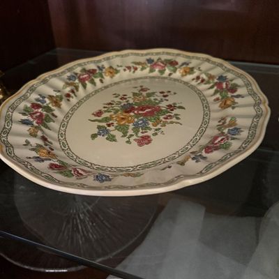 Sale Photo Thumbnail #37: Vintage oval floral porcelain serving platter with scalloped rim and geometric detail band.