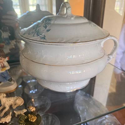 Sale Photo Thumbnail #102: Vintage white porcelain tureen with lid, featuring teal floral accents and gold trim.