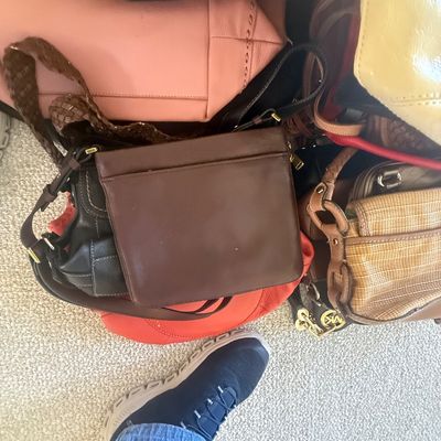 Sale Photo Thumbnail #166: Collection of assorted leather and woven women's handbags in various colors including brown, pink, black, and yellow.