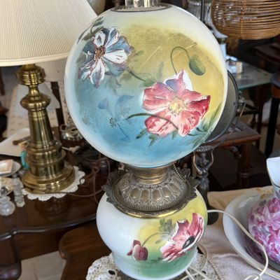 Sale Photo Thumbnail #4: Antique GWW hand-painted parlor lamp featuring a globe shade and base decorated with floral poppy motifs and brass fittings.