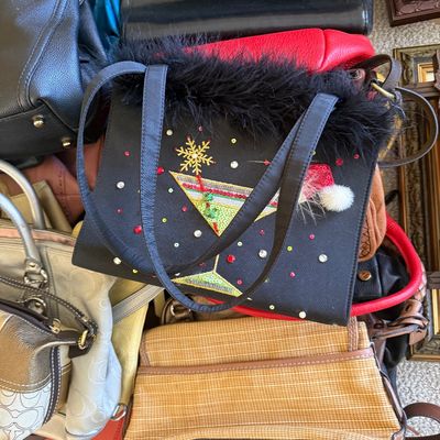 Sale Photo Thumbnail #27: Collection of women's handbags including a festive sequined martini glass shoulder bag trim with faux fur, along with woven and leather purses.
