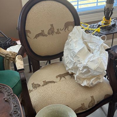 Sale Photo Thumbnail #73: French provincial style armchair with dark wood frame and leopard-motif upholstered seat and back.