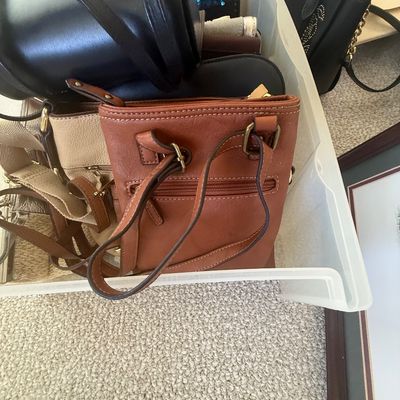 Sale Photo Thumbnail #196: Clear plastic storage tote filled with various leather and fabric handbags, including a black Michael Kors purse.