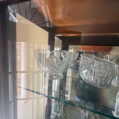 Sale Photo Thumbnail #154: Vintage glass swan motif bowl displayed inside a wooden china cabinet alongside matching glassware and patterned dishware.