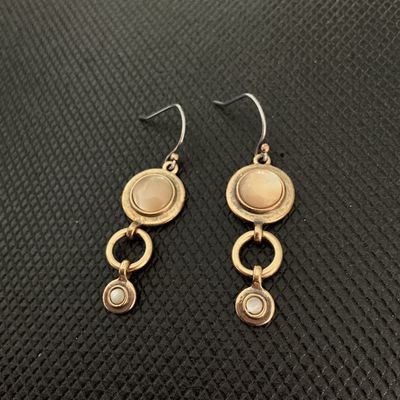 Sale Photo Thumbnail #192: Pair of vintage-style bronze tone dangle/drop earrings featuring round inlaid mother-of-pearl or neutral tone cabochons connected by open circle links. Shepherd hook ear wires. Good pre-owned condition with light surface wear.