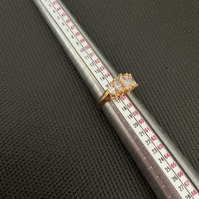 Sale Photo Thumbnail #157: Gold-tone band featuring five marquise-cut clear stones set across the front. Shown on ring mandrel measuring approximately size 7.5 to 8. Good pre-owned condition with light wear visible on the band.