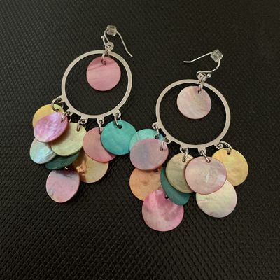 Sale Photo Thumbnail #142: Pair of silver-tone hoop chandelier dangle earrings featuring colorful, iridescent mother of pearl shell discs in shades of pink, teal, yellow, and orange. Fitted with fishhook backs and plastic stoppers. In good pre-owned condition with no visible damage