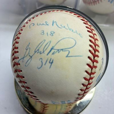 Sale Photo Thumbnail #101: Autographed baseball signed by Gaylord Perry with a career win inscription, housed in a clear protective display case.